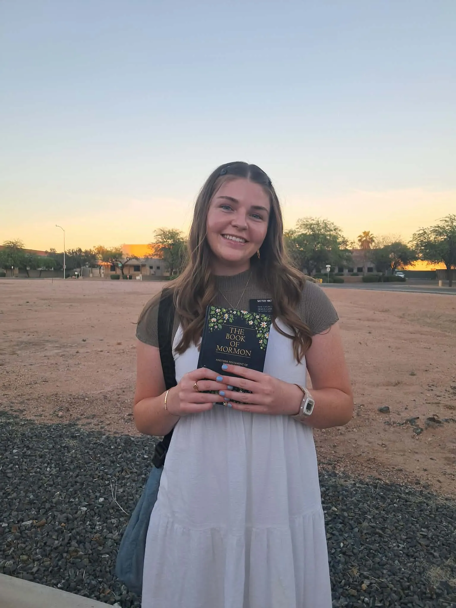 Sister Hinton with her painted Book of Mormon